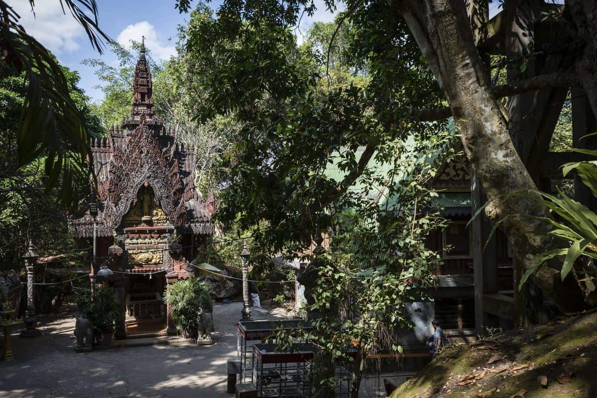 Carved temple in a green forest